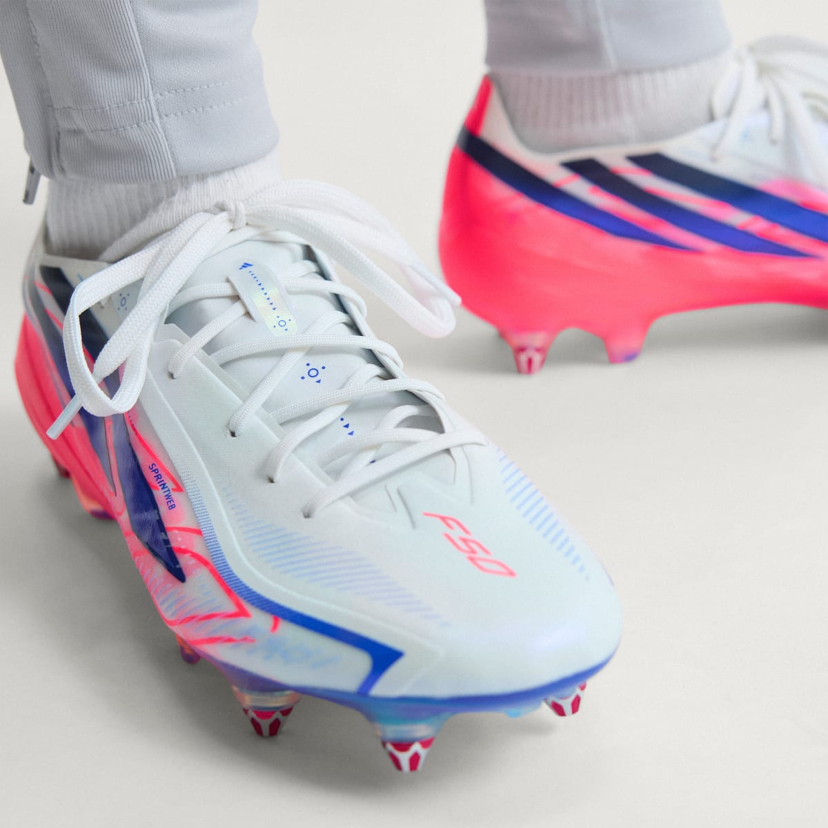 adidas Women's F50 Hyperfast Elite Soft Ground Soccer Cleats - Cloud White / Solar Purple / Solar Turbo