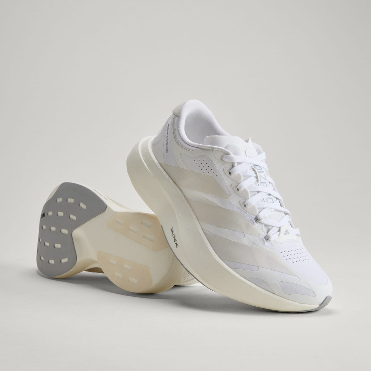 adidas Women's Adizero EVO SL EXO Shoes - Cloud White / Zero Metalic / Core White