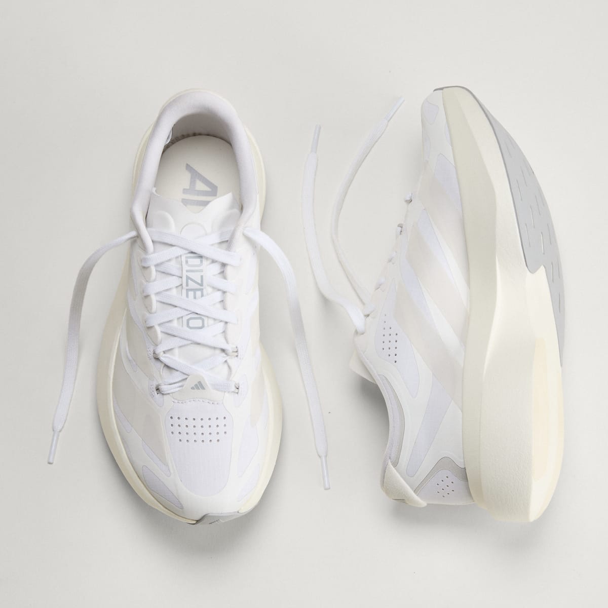 adidas Women's Adizero EVO SL EXO Shoes - Cloud White / Zero Metalic / Core White