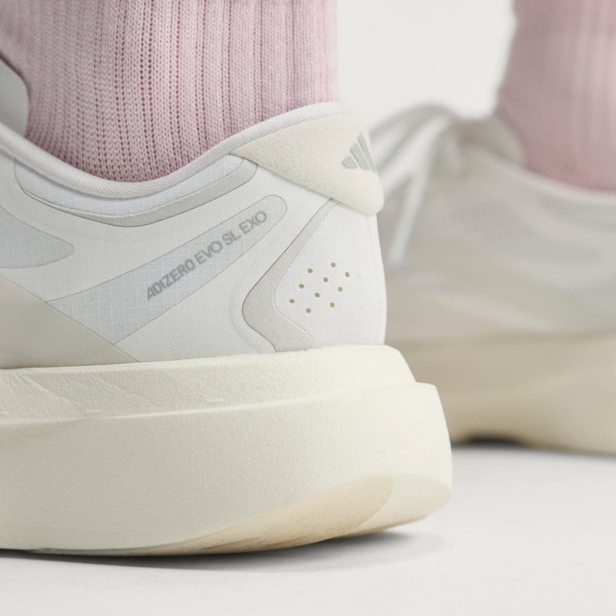 adidas Women's Adizero EVO SL EXO Shoes - Cloud White / Zero Metalic / Core White