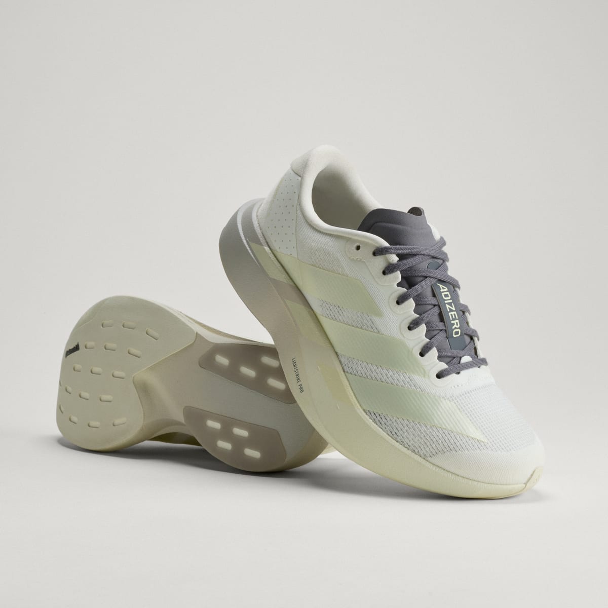 adidas Women's Adizero EVO SL Shoes - Off White / Ice Gold Met. / Granite