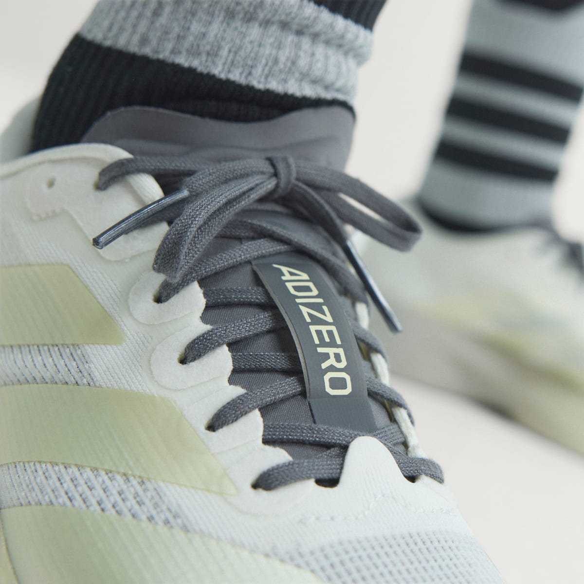 adidas Women's Adizero EVO SL Shoes - Off White / Ice Gold Met. / Granite