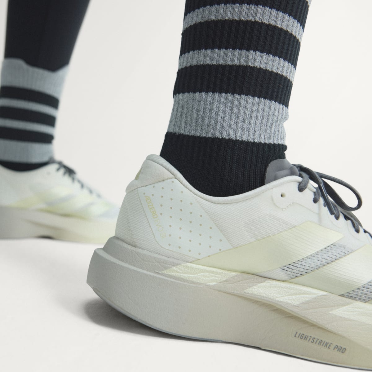adidas Women's Adizero EVO SL Shoes - Off White / Ice Gold Met. / Granite