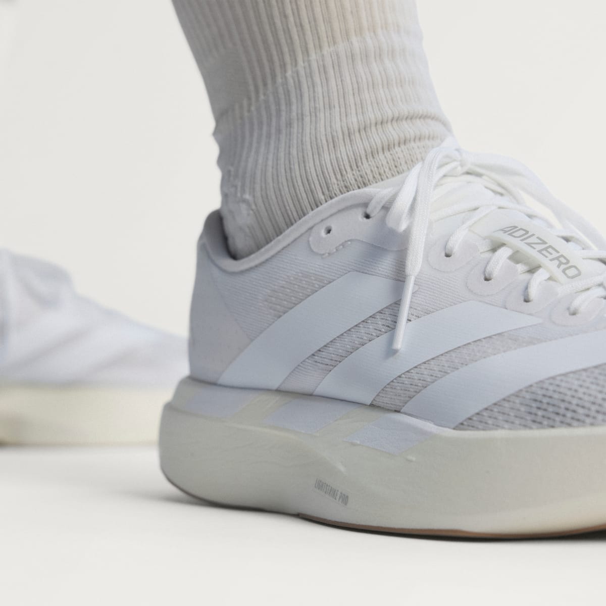 adidas Women's Adizero EVO SL Shoes - Cloud White / Cloud White / Warm Sandstone