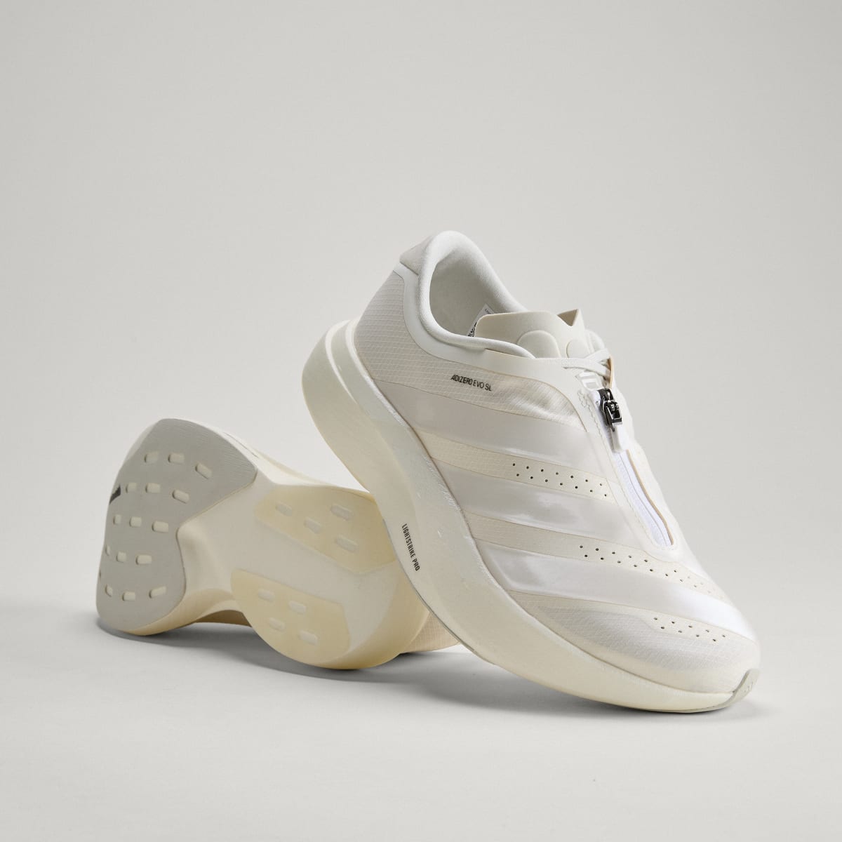 adidas Women's Adizero EVO SL Zip Running Shoes - Core White / Zero Metalic / Orbit Grey