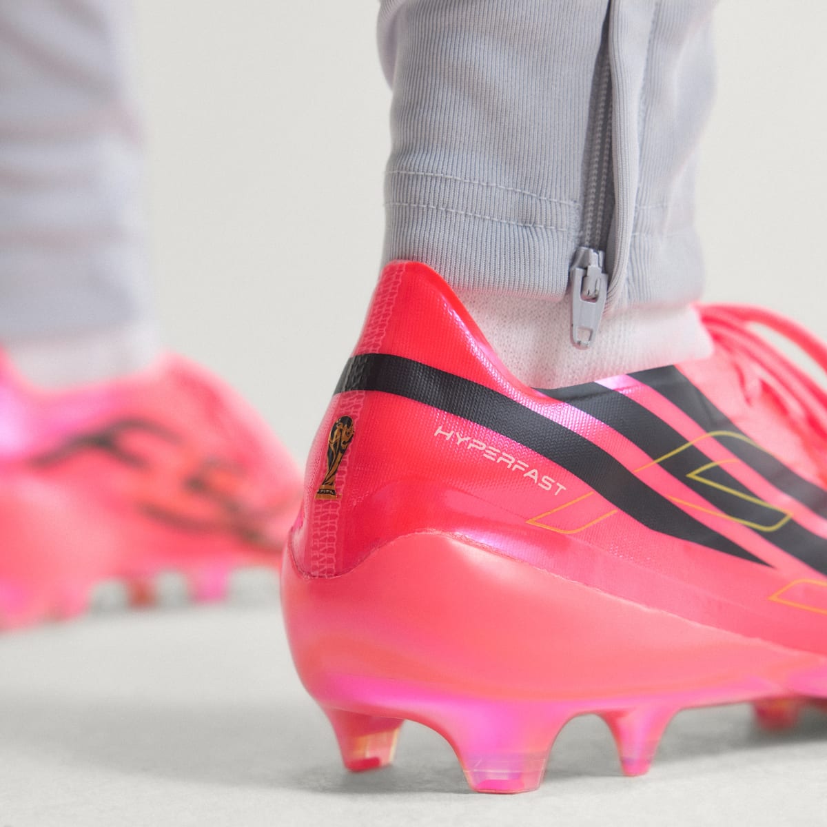 adidas Women's F50 Hyperfast EVO Firm Ground Soccer Cleats - Solar Turbo / Core Black / Gold Metallic
