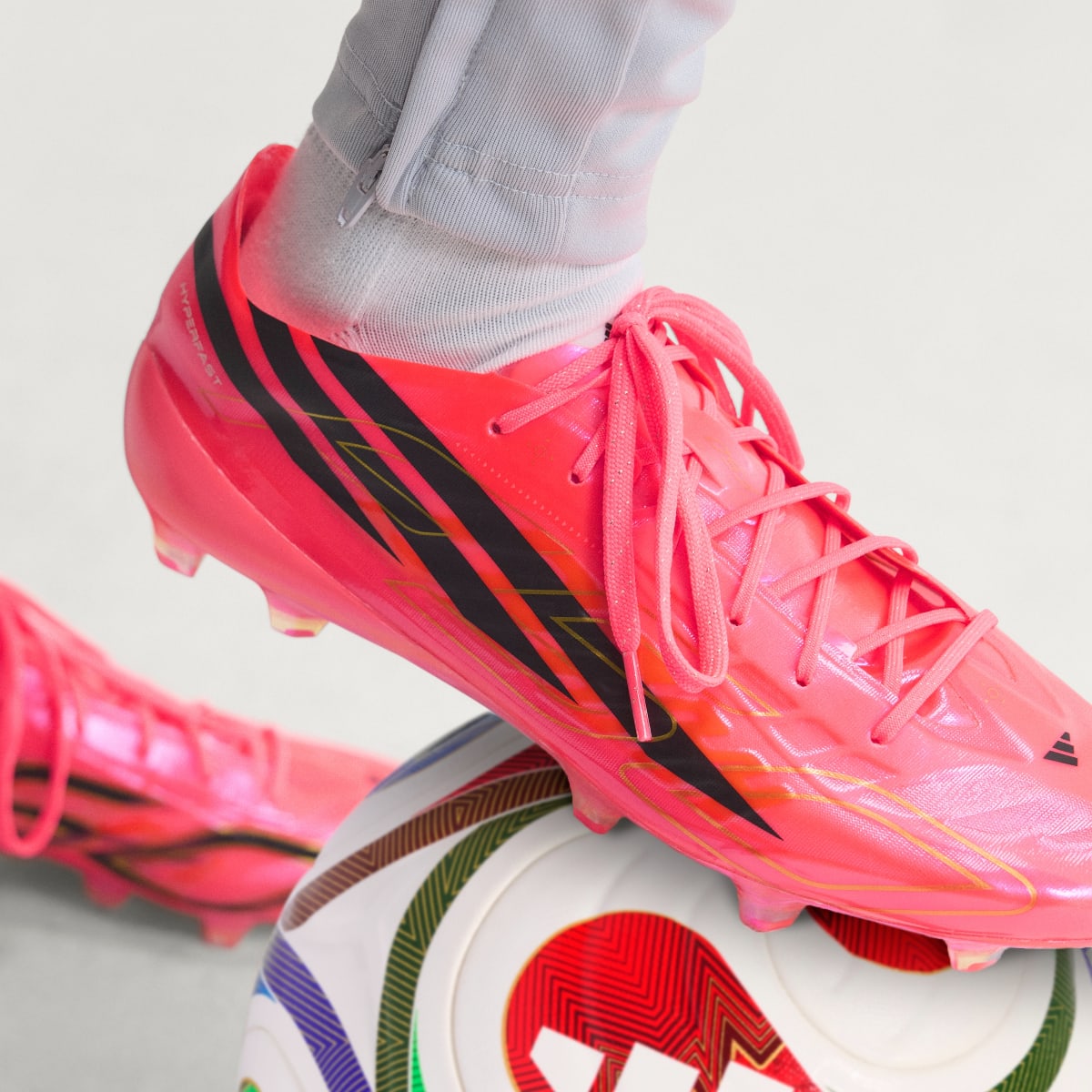 adidas Women's F50 Hyperfast EVO Firm Ground Soccer Cleats - Solar Turbo / Core Black / Gold Metallic