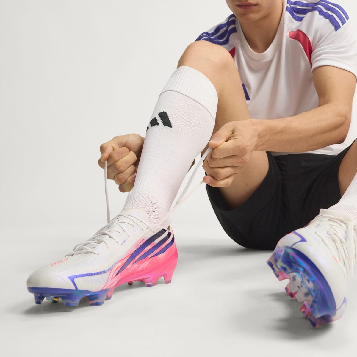 adidas Women's F50 Hyperfast Elite Firm Ground Soccer Cleats - Cloud White / Solar Purple / Solar Turbo