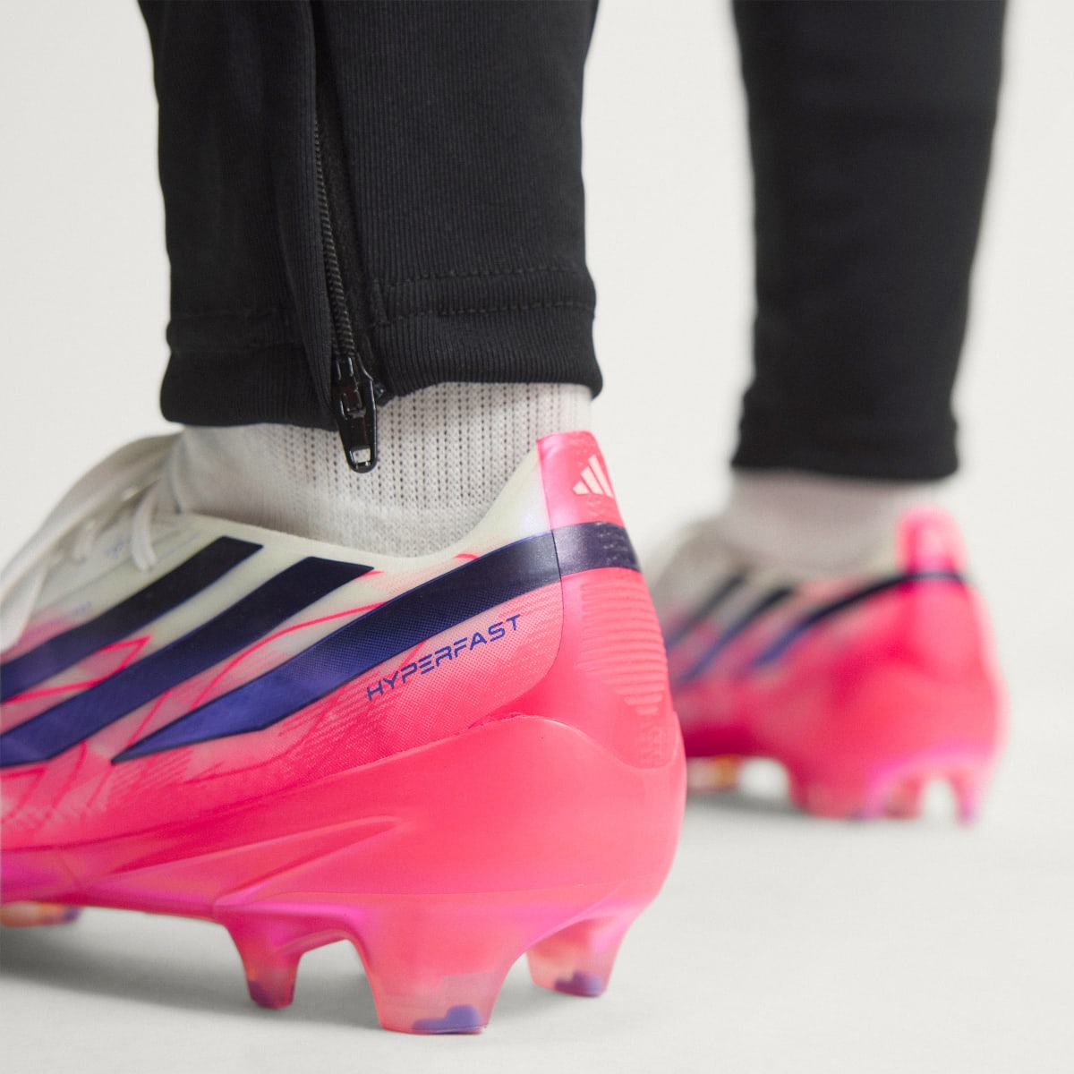 adidas Women's F50 Hyperfast Elite Firm Ground Soccer Cleats - Cloud White / Solar Purple / Solar Turbo