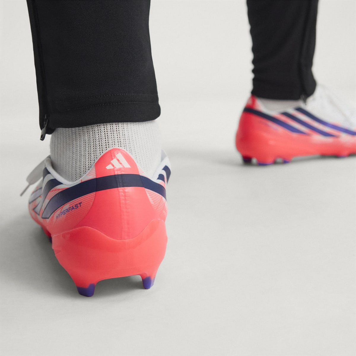 adidas Women's F50 Hyperfast League Firm Ground Soccer Cleats - Cloud White / Solar Purple / Solar Turbo