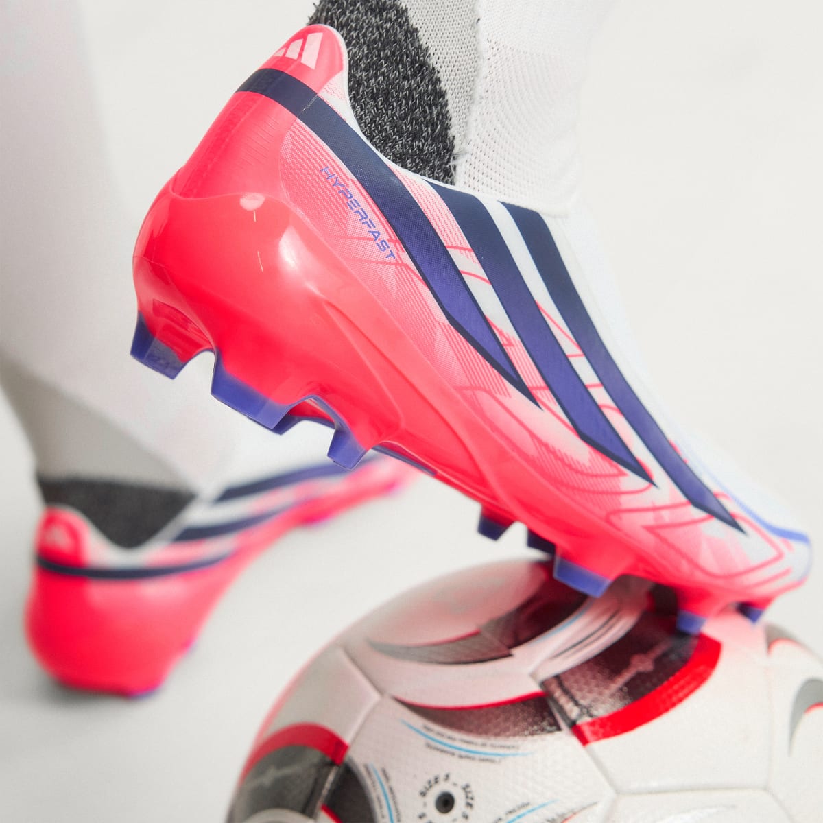 adidas Women's F50 Hyperfast League Laceless Firm Ground Soccer Cleats - Cloud White / Solar Purple / Solar Turbo