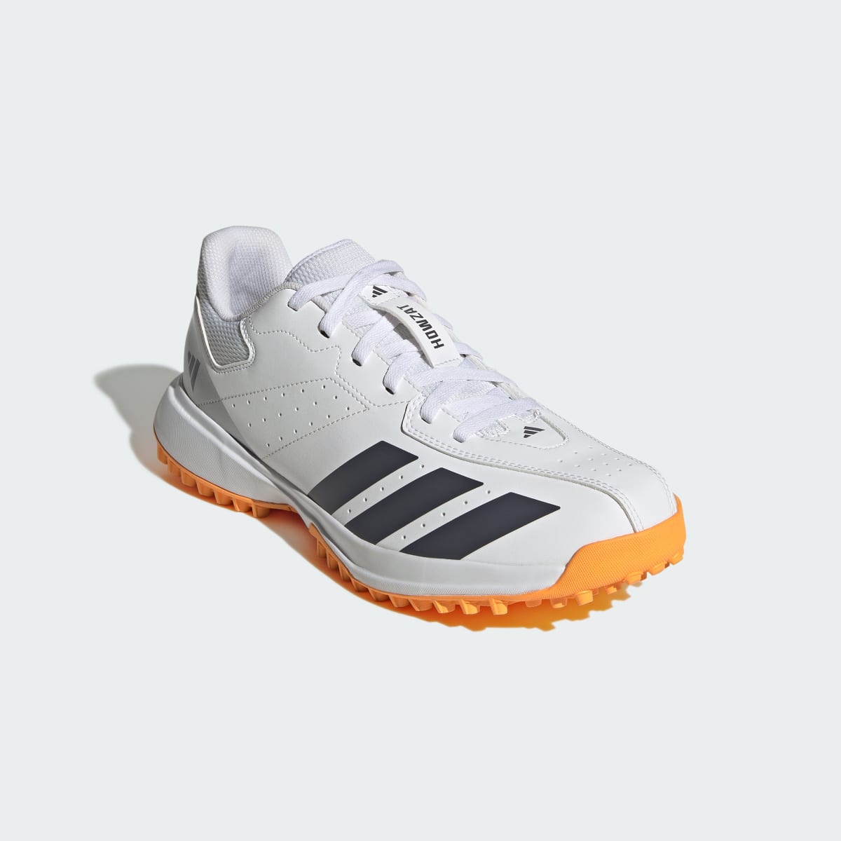 adidas Men's Howzat Spikeless Cricket Shoes - Cloud White / Aurora Onix / Lucid Tangerine