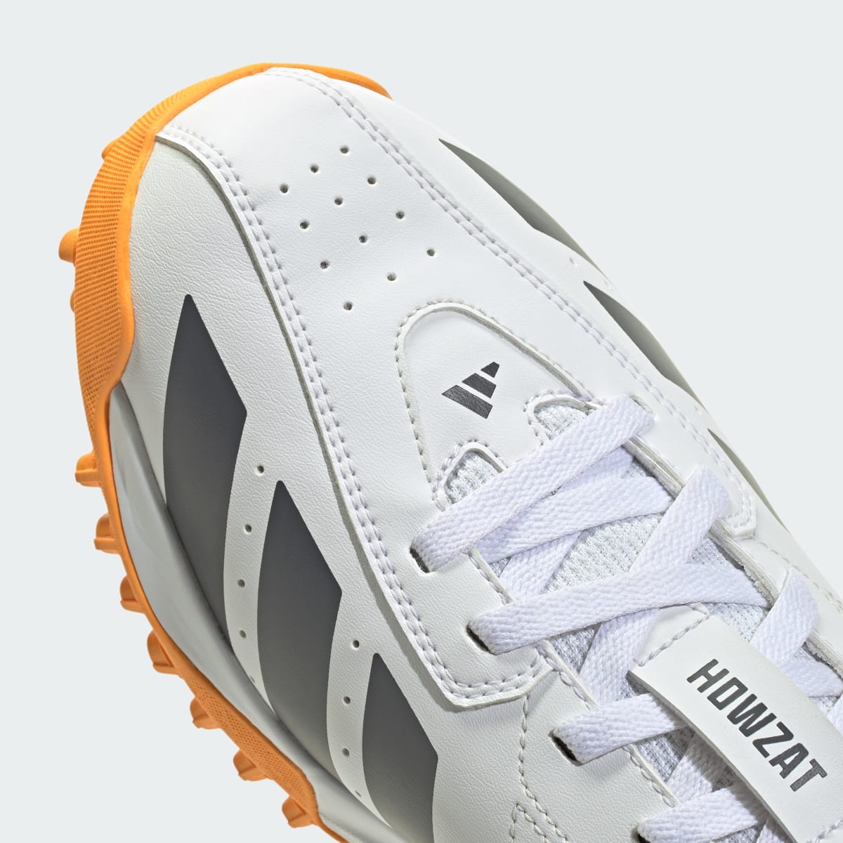 adidas Men's Howzat Spikeless Cricket Shoes - Cloud White / Aurora Onix / Lucid Tangerine
